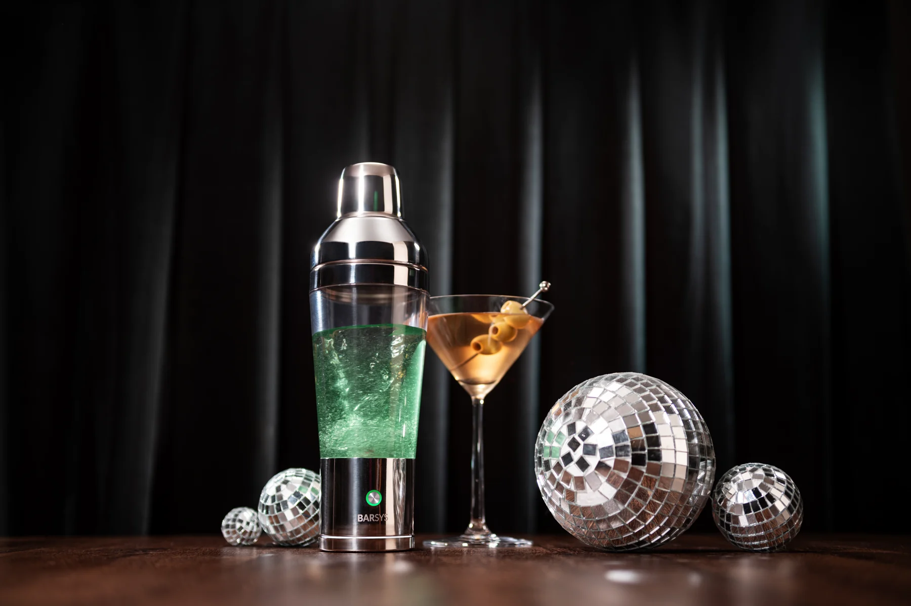 Shaker Pro beside a freshly made cocktail