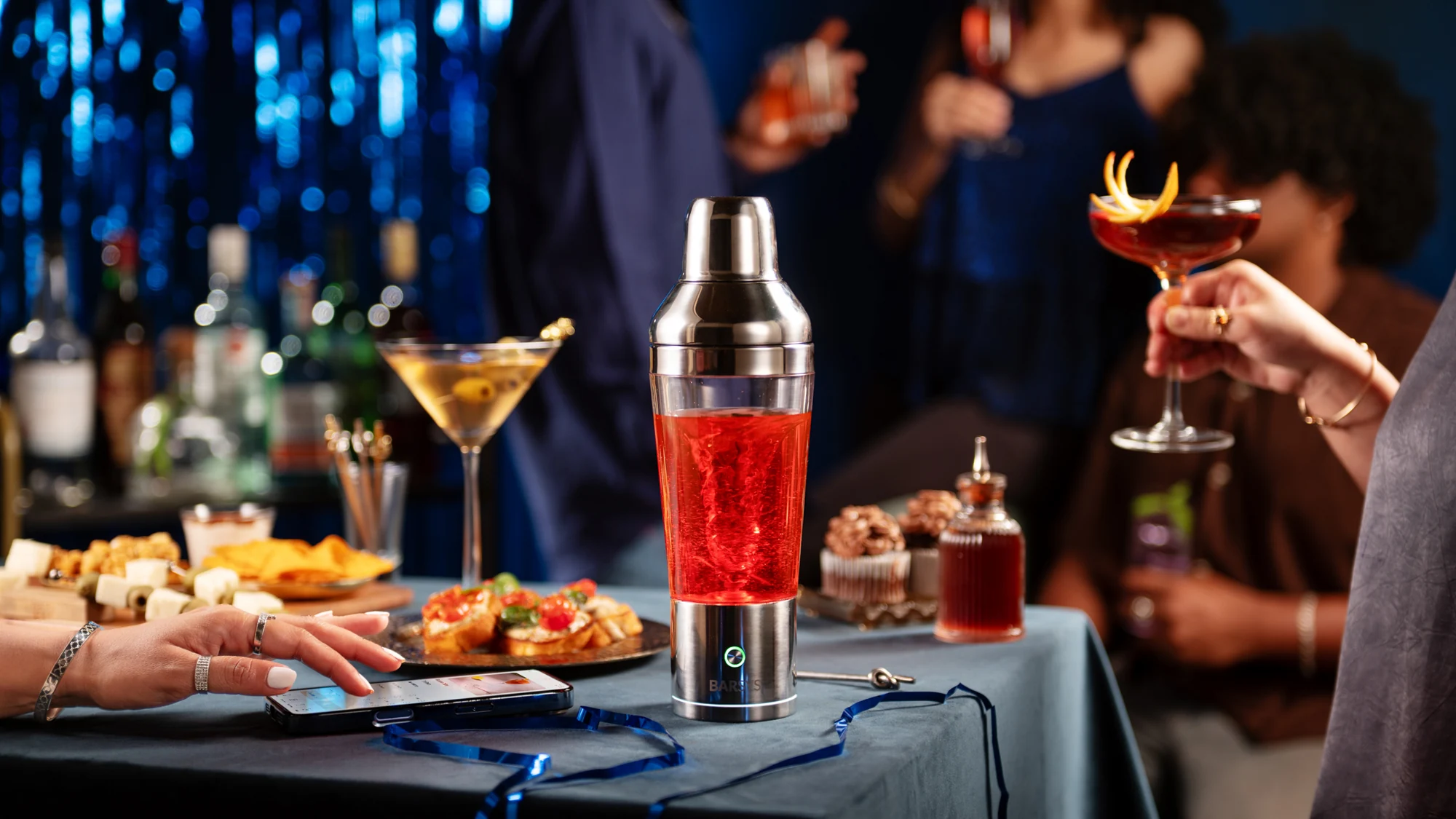 Shaker Pro beside a freshly made cocktail